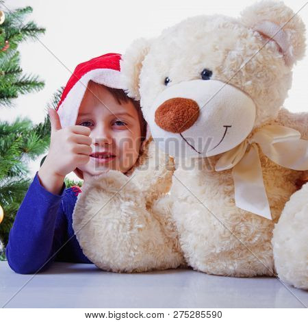New Year Concept. Close Up Portrait Of Cutel Little Child Girl Playing With Taddy Bear.