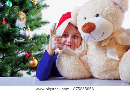 New Year Holiday Concept. Portrait Of Cutel Little Child Girl Playing With Taddy Bear.