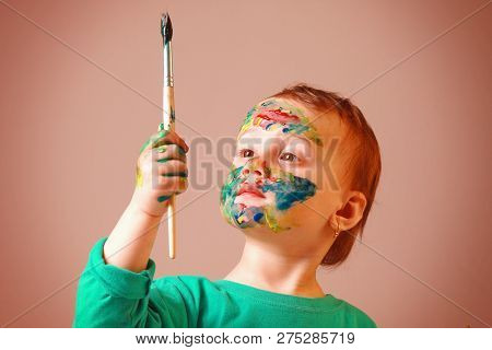 Great Artist. Humorous Picture Of Cutel Little Child Girl Draws A Picture Paints.