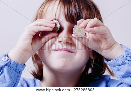 Happy Business Child With Coints As Symbol Of Best Motivation Is Money.