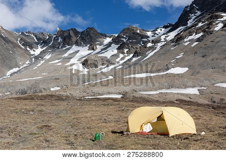 Camping In Himalayan Mountains. Nepal. Yellow Tent Under Mesokanto Pass. Himalayas.