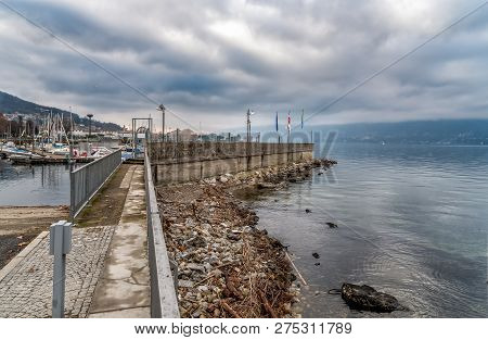 New Harbor Of Luino On The Lake Maggiore In Cloudy Day, Province Of Varese, Italy