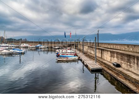 New Harbor Of Luino On The Lake Maggiore In Cloudy Day, Province Of Varese, Italy