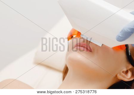 Girl Removes Unwanted Facial Hair. Laser Removal Close-up. Concept Of Self-care, Beauty And Health
