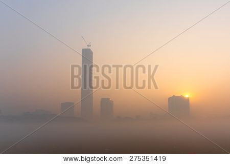 Beautiful Image Of Sunrise At Kolkata Maidan In A Foggy Winter Morning. Sunrises At The Horizon Abov