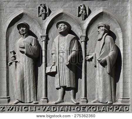 ZURICH, SWITZERLAND - JUNE 23, 2018: Fathers of the Reformed Churches of Switzerland: Zwingli, Vadian, Oecolampadius, door of the Grossmunster (