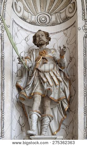 LUCERNE, SWITZERLAND - JUNE 24, 2018: Saint Clement statue on the facade of the church of St. Leodegar in Lucerne, Switzerland