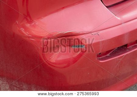 Red Crash From Red Car Accident. Dent On Bumper