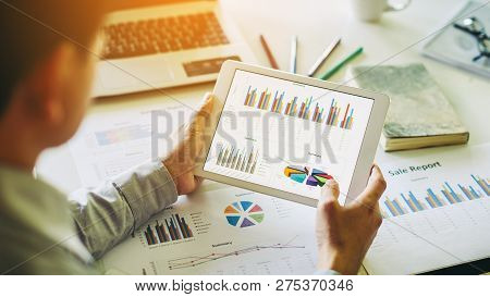 Businessman Investment Consultant Analyzing Company Financial Report Balance Sheet Statement Working