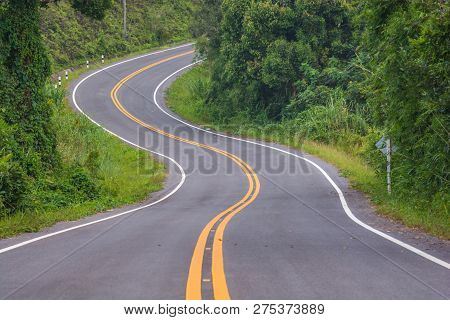 Asphalt Road In Countryside On Sunny Summer Day