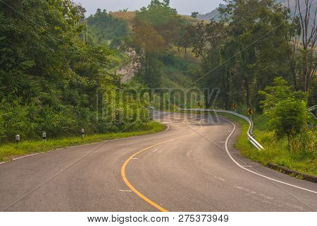 Asphalt Road In Countryside On Sunny Summer Day