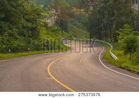 Asphalt Road In Countryside On Sunny Summer Day