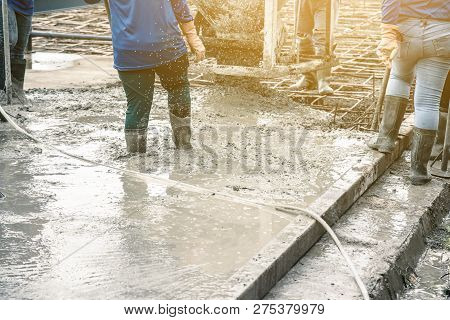 Pouring Ready-mixed Concrete From Mixing Mobile The Concrete Mixer Into Basket Steel To Lift The Con