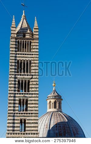 Bell Tower And The Dome Of The Siena Cathedral (santa Maria Assunta) 1220-1370 With Clear Blue Sky. 