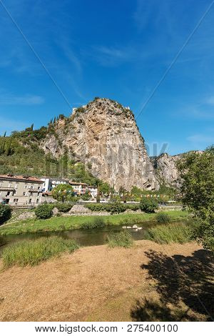 Rock Face And The Sarca River In Arco Di Trento, Small Town Near The Lake Garda, Trentino Alto Adige