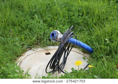 High Voltage Cable Sticks Out Of The Ground
