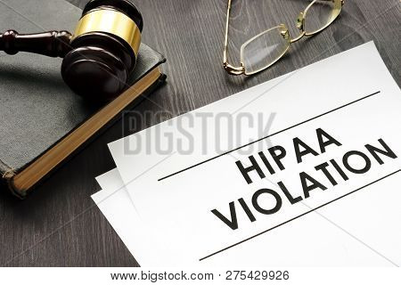 Documents About Hipaa Violation And Gavel In A Court.