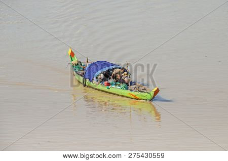 Phnom Penh, Cambodia - April 9, 2018:   Typical Long-tail Cambodian Mekong Boat With A Canopy, An  A