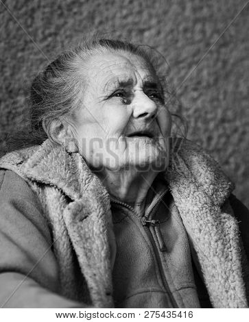 Very Old And Tired Wrinkled Woman Outdoors