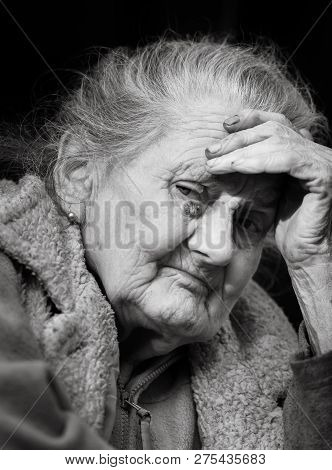 Very Old And Tired Wrinkled Woman Outdoors