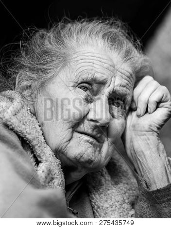 Very Old And Tired Wrinkled Woman Outdoors