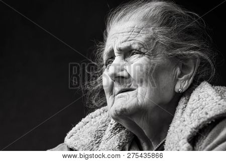 Very Old And Tired Wrinkled Woman Outdoors