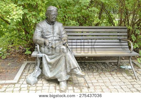 Warsaw, Poland - July 29, 2018: Bench Sculpture For Father 