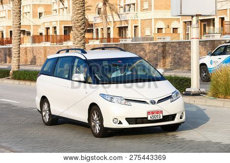 Dubai, Uae - November 18, 2018: White Minivan Toyota Previa In The City Street.