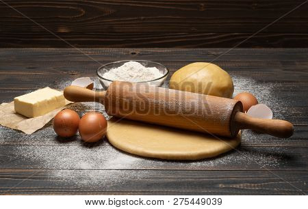 Rolled And Unbaked Shortcrust Pastry Dough Recipe On Wooden Background