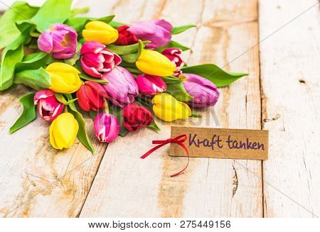 Multicolored Tulips Arrangement With Gift Card With German Text, Kraft Tanken, Means Relaxation