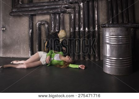 A Man In A Gas Mask Carries Away A Suffocated Girl