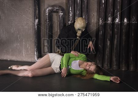 A Man In A Gas Mask Carries Away A Suffocated Girl