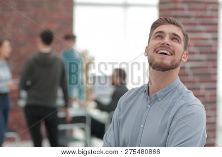 Cheerful man smiling  in office.