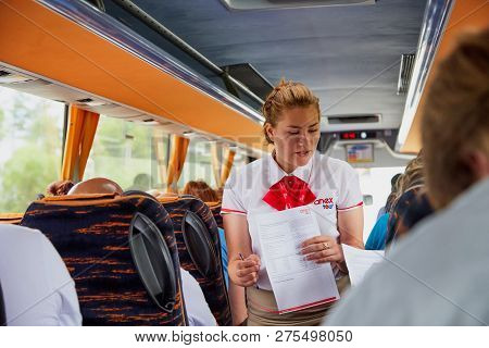 Marmaris, Turkey - May 26, 2018: Female Guide In The Bus With Tourists. People During Travel. Transf