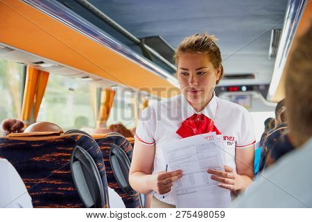 Marmaris, Turkey - May 26, 2018: Female Guide In The Bus With Tourists. People During Travel. Transf