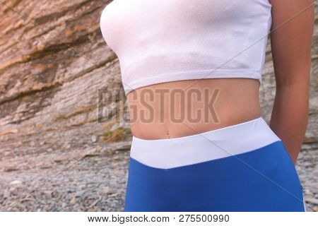 Flat Belly Girl During Breathing Exercises Bodyflex. Belly Close-up View.