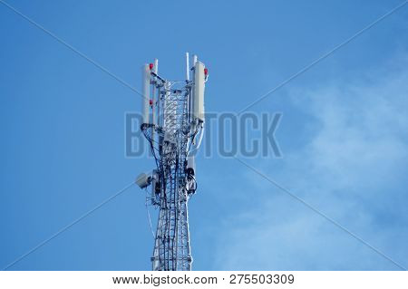 Communication Tower Or 3g 4g Network Telephone Cellsite Silhouette On Blue Sky And Space For Text. F