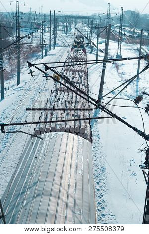 Rail Cars Loaded With The Wood Being Transported From Nearby Mines To Power Plants In Winter