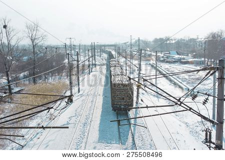 Rail Cars Loaded With The Wood Being Transported From Nearby Mines To Power Plants In Winter