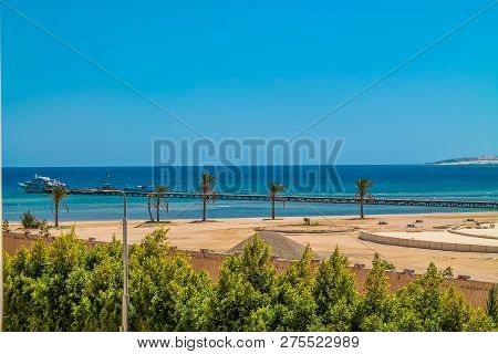 The View From The Hotel Window To The Red Sea, The Beach And The Marina Under The Blue Sky