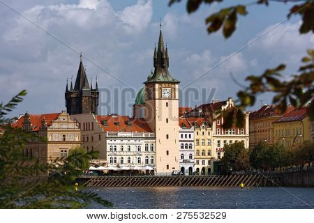 PRAGUE, CZECH REPUBLIC - SEPTEMBER 15, 2018: View to the Old Town Water tower on waterfront of Vltava river. Built in 1577, the tower acquired another floor and the clock tower in 1878