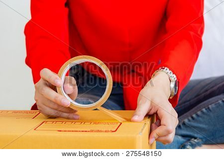 Beautiful Young Women Paking A Parcel Boxes.  E-commerce And Start Up Business Concept.