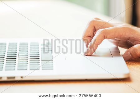 Women Using A Trackpad On The Modern Laptop To Access Into The Internet.  Concept Of Digital Life Wi