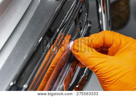 Car Polish Wax Worker Hands Applying Protective Tape Before Polishing. Buffing And Polishing Car. Ca
