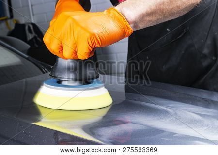 Car Polish Wax Worker Hands Applying Protective Tape Before Polishing. Buffing And Polishing Car. Ca