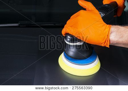 Car Polish Wax Worker Hands Applying Protective Tape Before Polishing. Buffing And Polishing Car. Ca