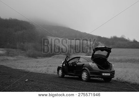 Oparno, Czech Republic - December 19, 2018: Black Car Opel Astra Stand Under Lovos Hill Near Oparno