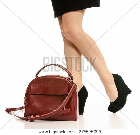 Woman Legs Feet Black Dress Shoes Red Purse Bag On White Baclground Isolation