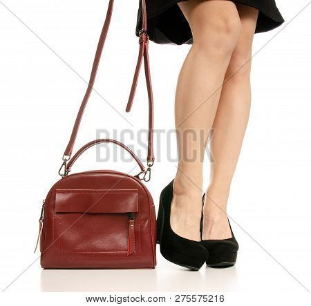 Woman Legs Feet Black Dress Shoes Red Purse Bag On White Baclground Isolation