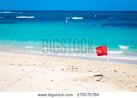 Red Flag Warning Sign At The Beack No Swimming